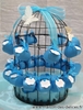 Cage  oiseaux orne de berlingots turquoises garnis de drages